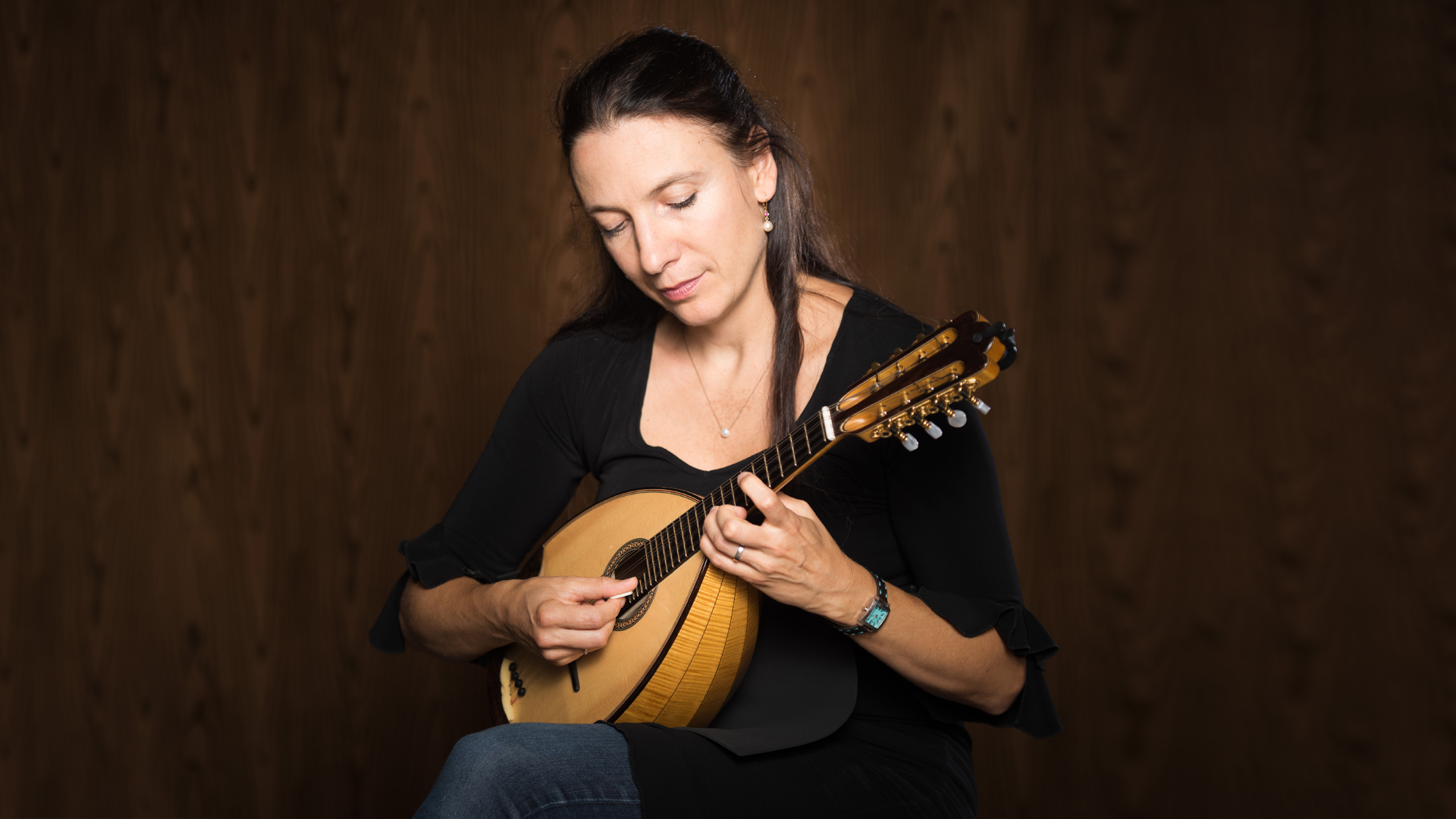 woman playing mandolin