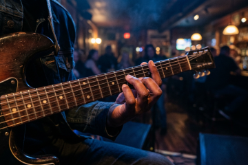Close-up of a guitarist's hands playing the pinky extension on a boogie shuffle