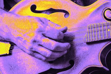Neon colorized close-up of a hand chopping the strings of a mandolin