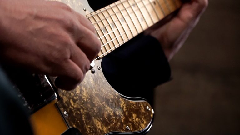 close up photo of Dave Isaacs playing a fender telecaster, demonstrating hybrid picking