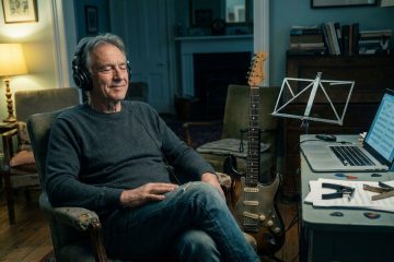 a man in his home office engaged in conscious listening practice